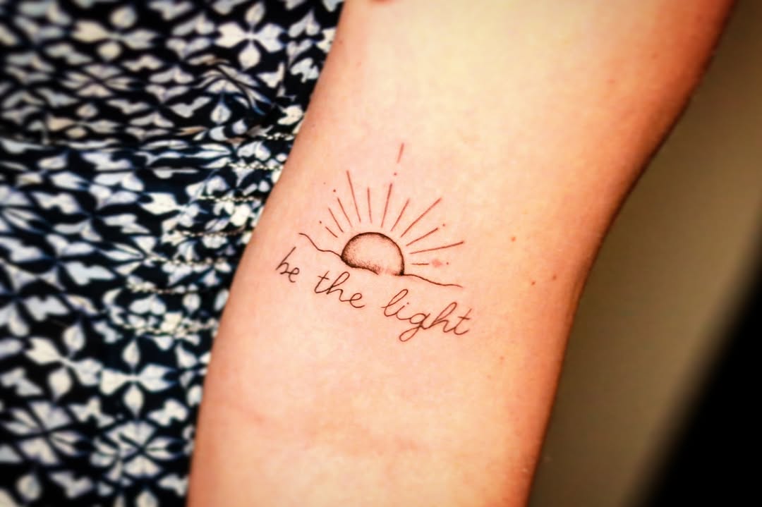 Inspiring sunrise tattoo with positive message