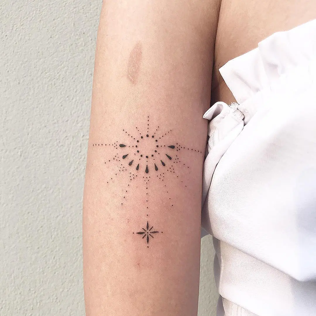 Elegant minimalist sunrise tattoo with dot work