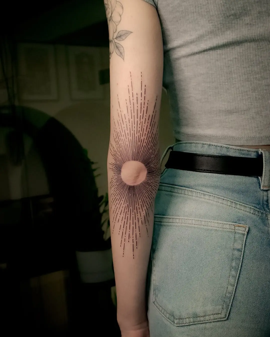 Bold sunrise tattoo radiating vibrant energy