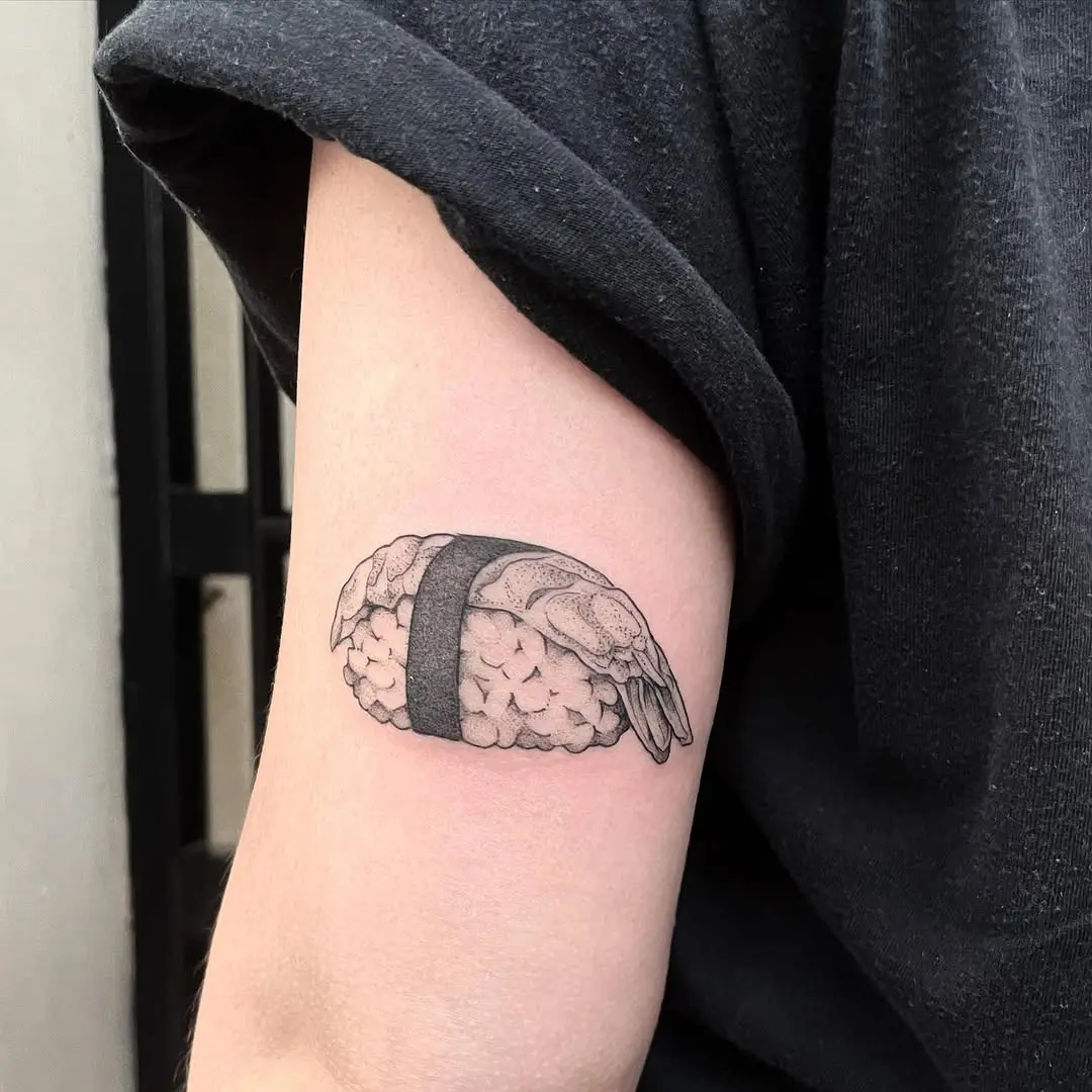 Stylish black line art sushi tattoo on arm