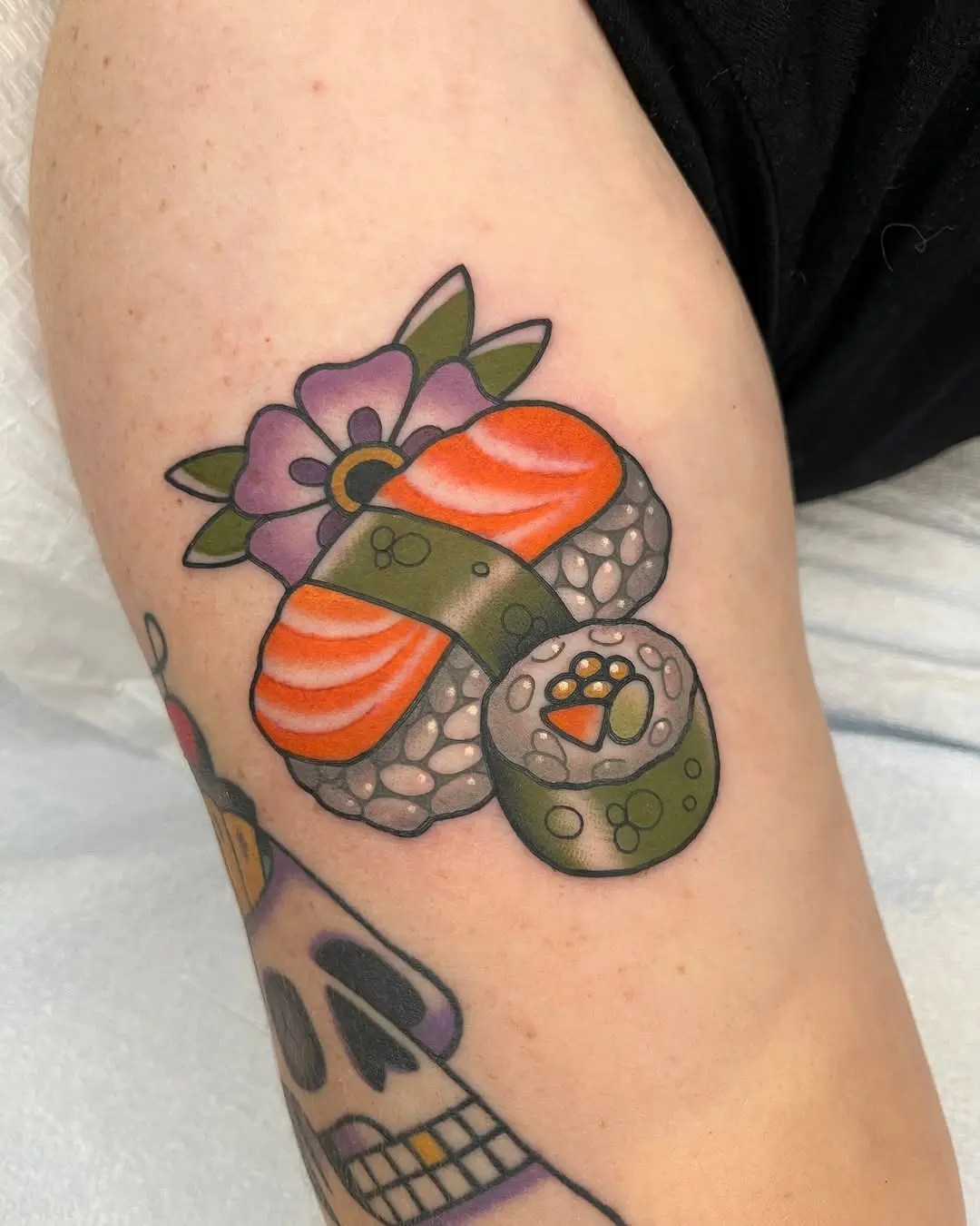 Vibrant Sushi Roll Tattoo with Floral Accents