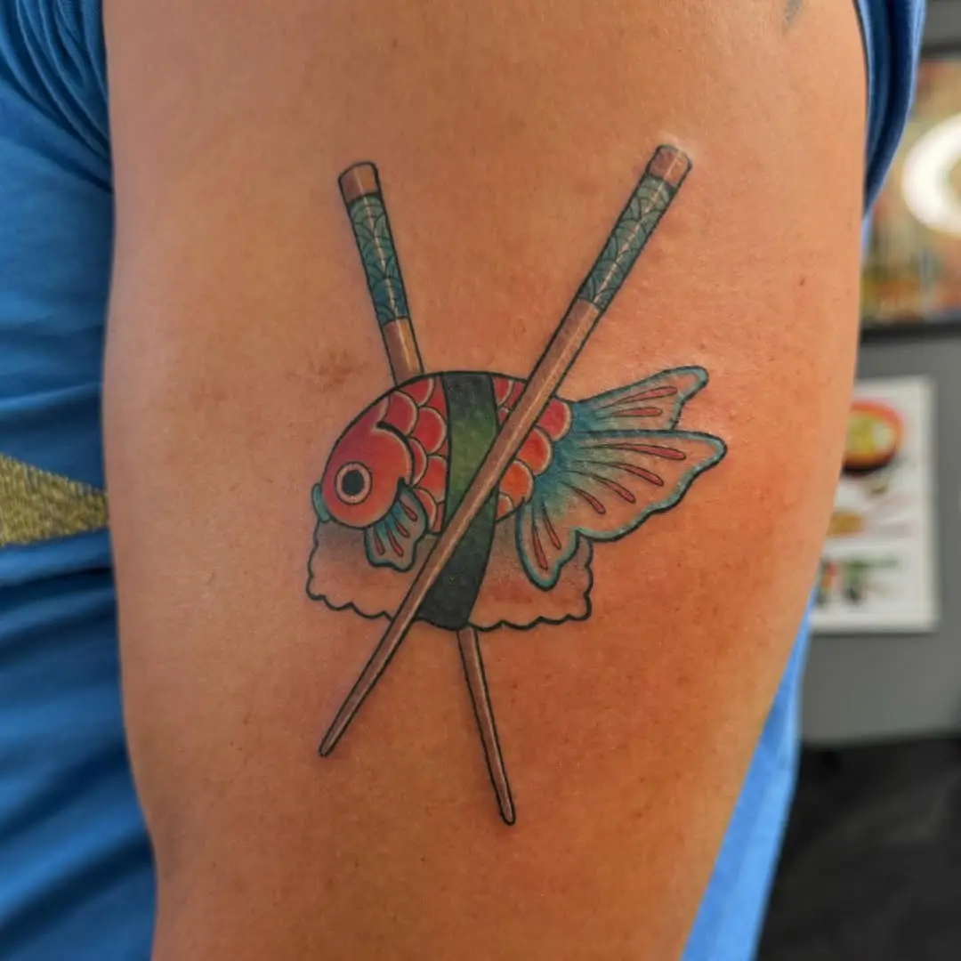 Vibrant sushi tattoo with fish and chopsticks