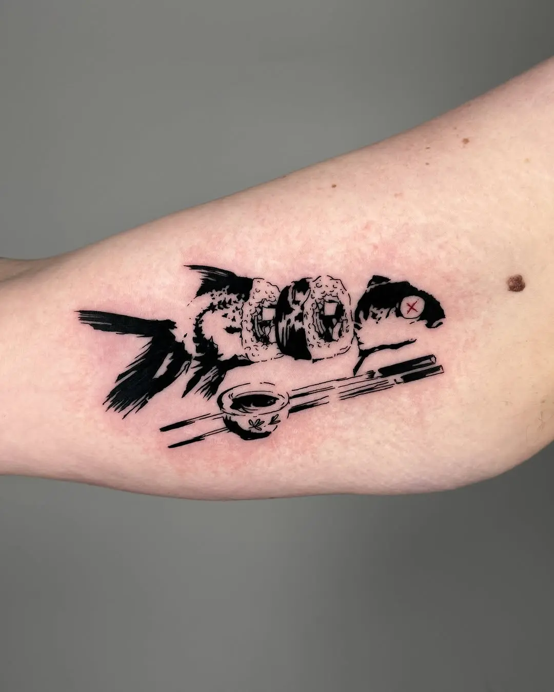 Unique sushi tattoo blending fish and rolls