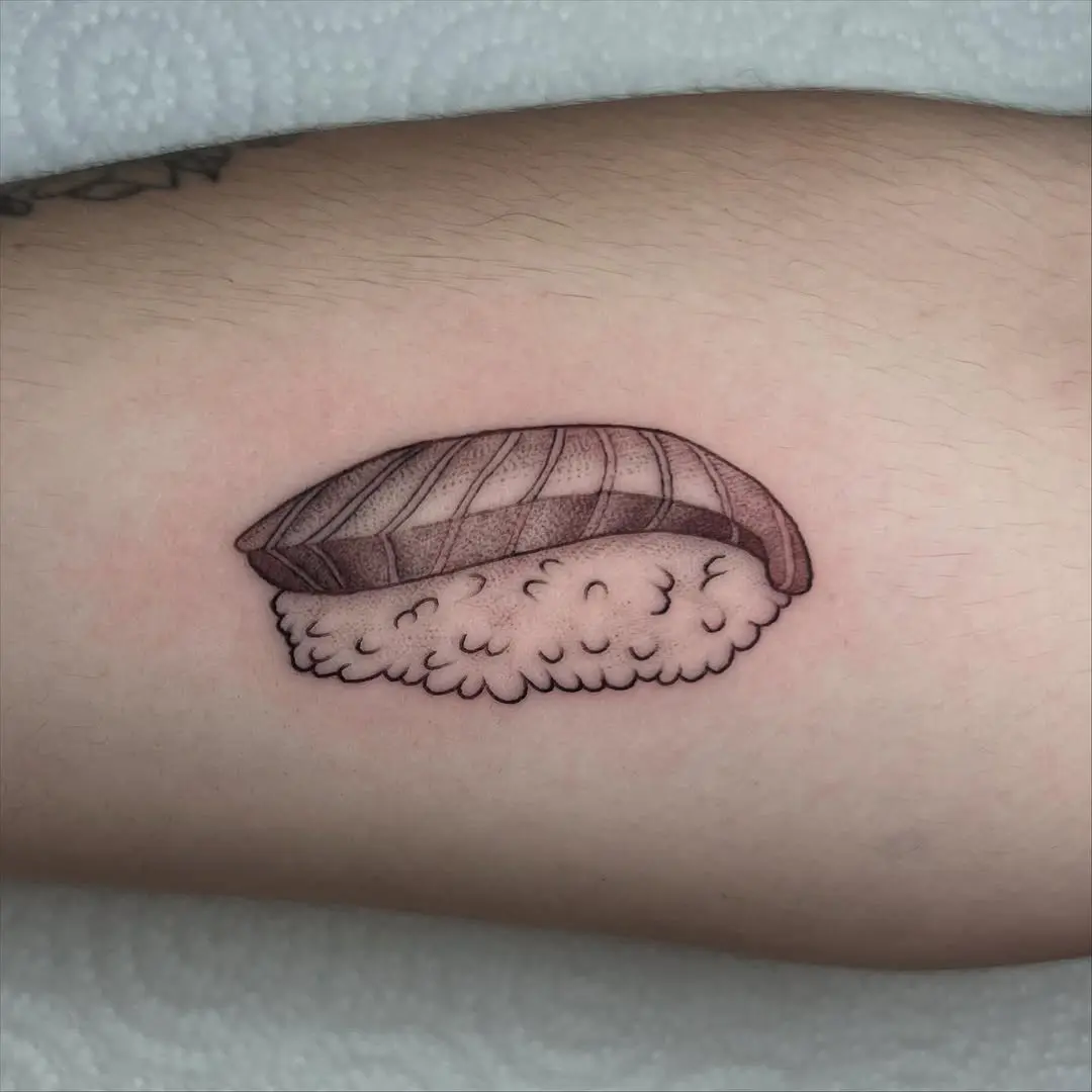 Adorable minimalist sushi tattoo on skin
