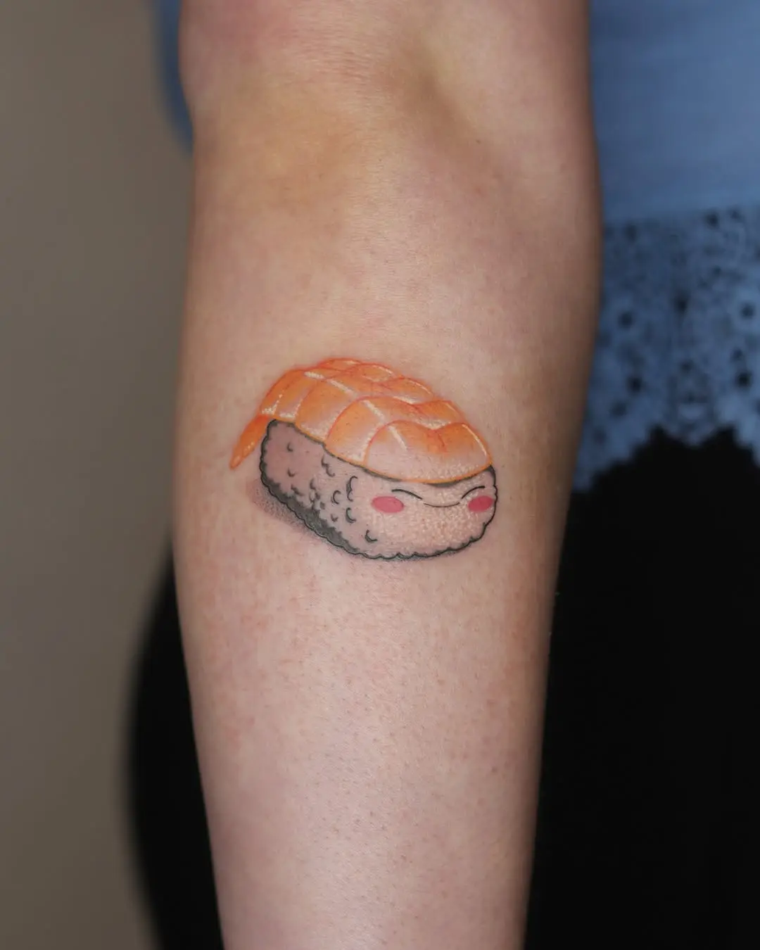 Adorable sushi tattoo showcasing colorful nigiri