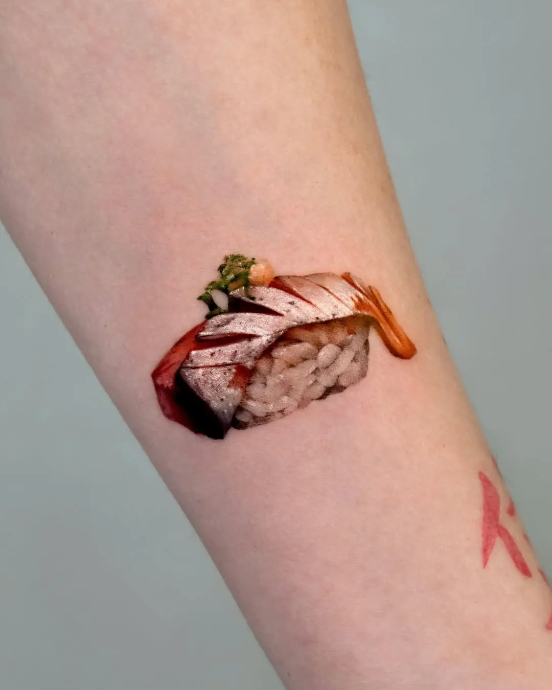 Realistic sushi tattoo showcasing exquisite detail