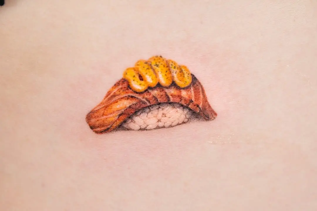 Intricate salmon sushi tattoo highlighting realism