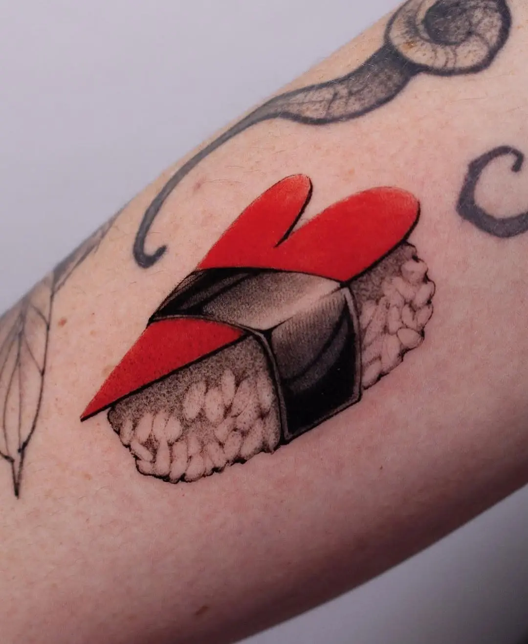 Sushi tattoo with love-themed design