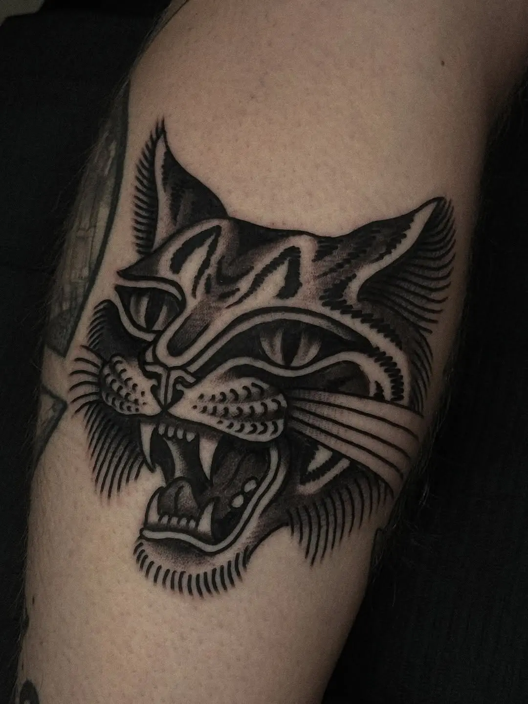 Fierce Feline Tattoo with Charismatic Details
