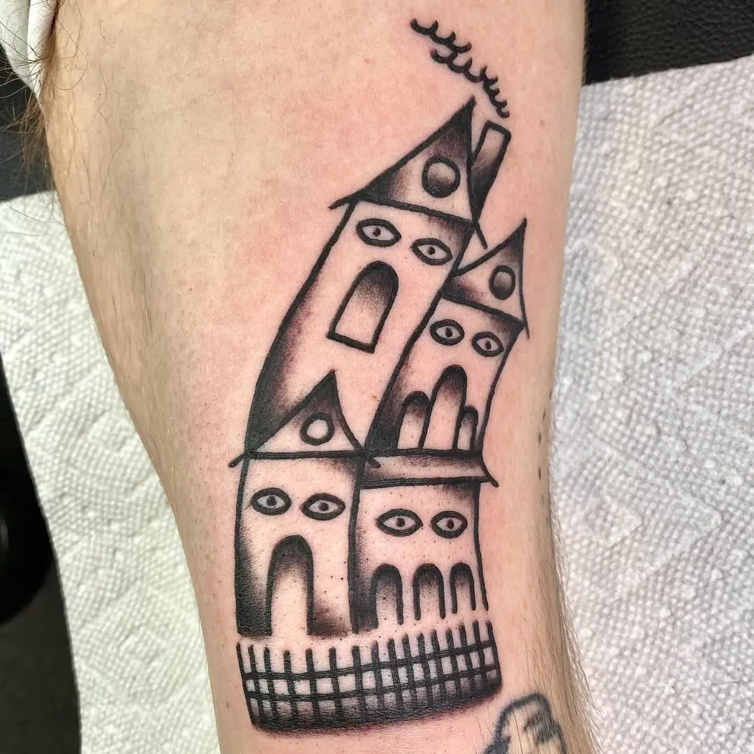 Quirky house tattoo with a surreal twist
