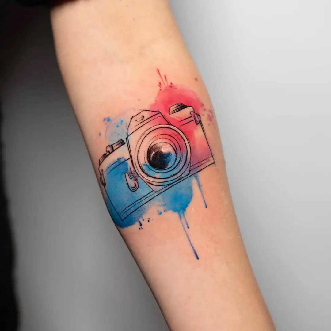 Colorful Camera Tattoo with Artistic Splashes