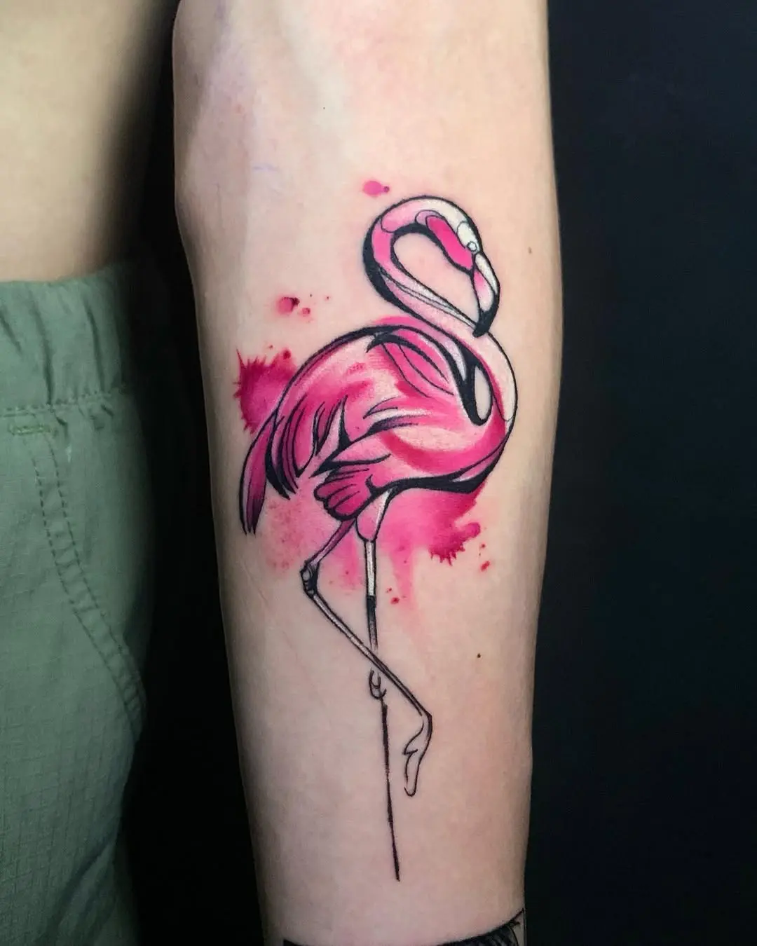 Elegant pink flamingo tattoo with watercolor splashes