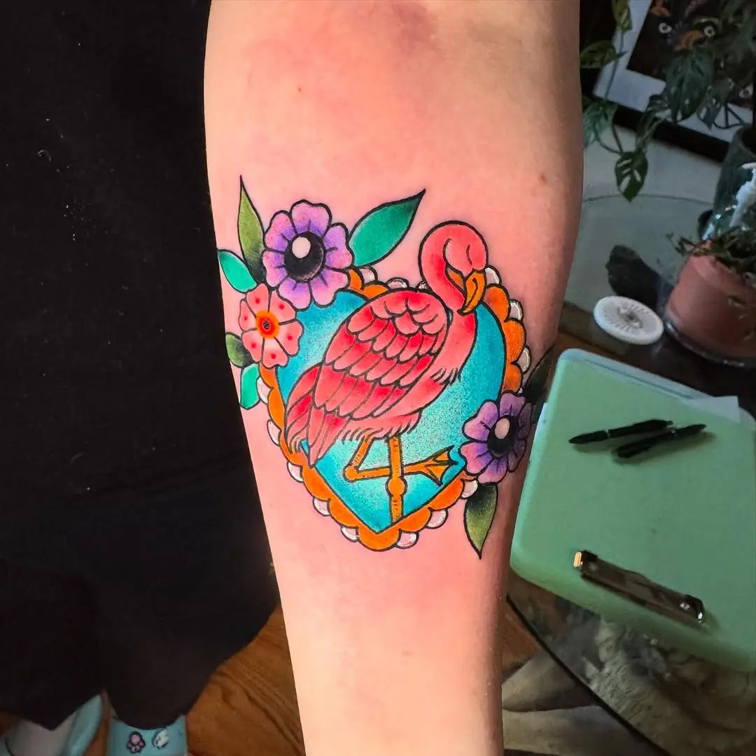 Colorful flamingo surrounded by floral designs