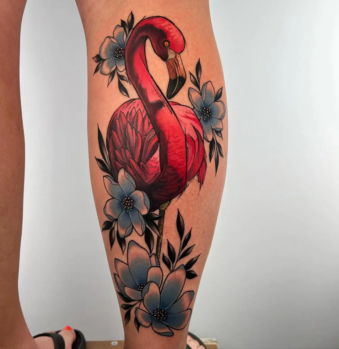 Stunning flamingo tattoo with floral accents