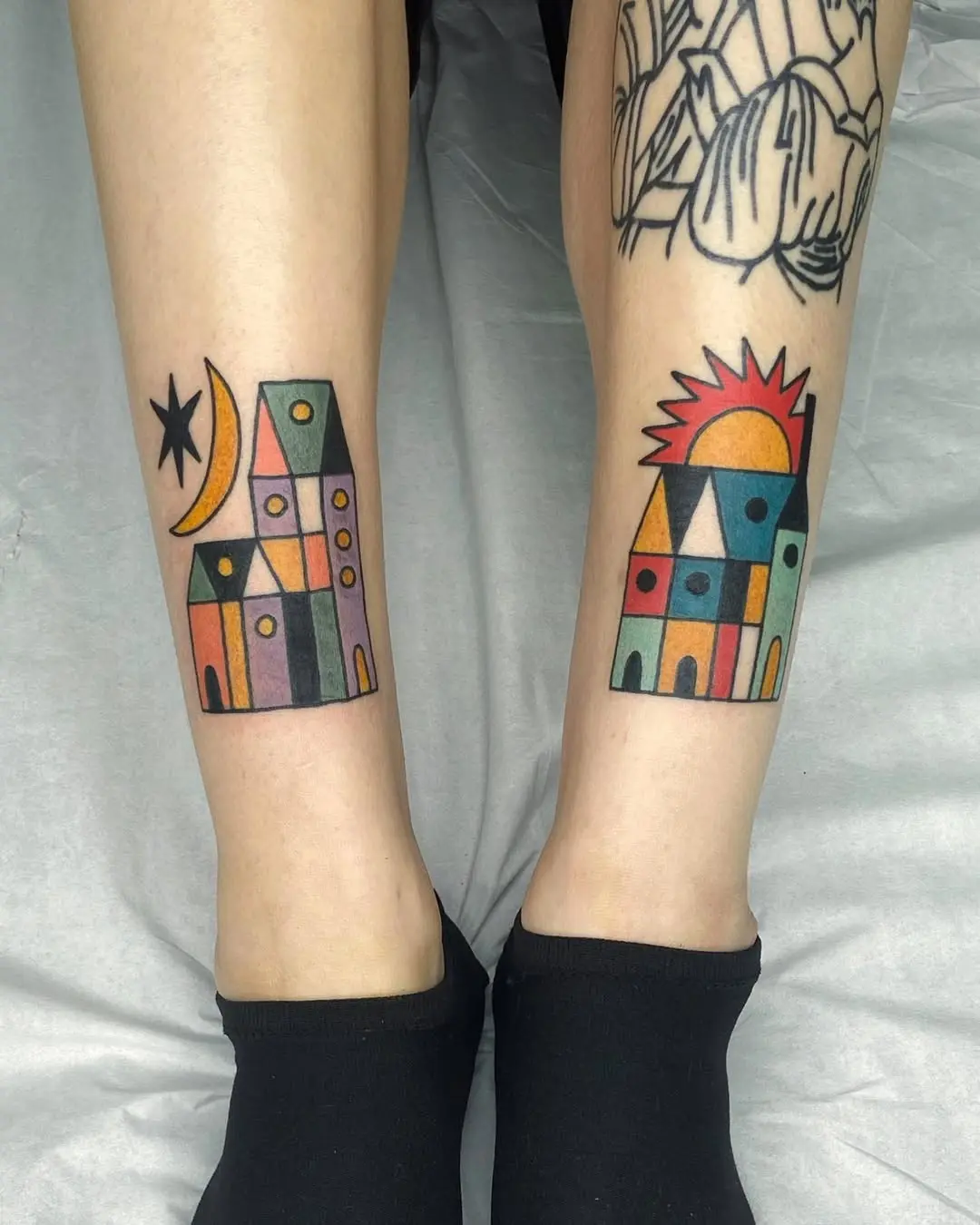 Colorful house tattoos with geometric flair
