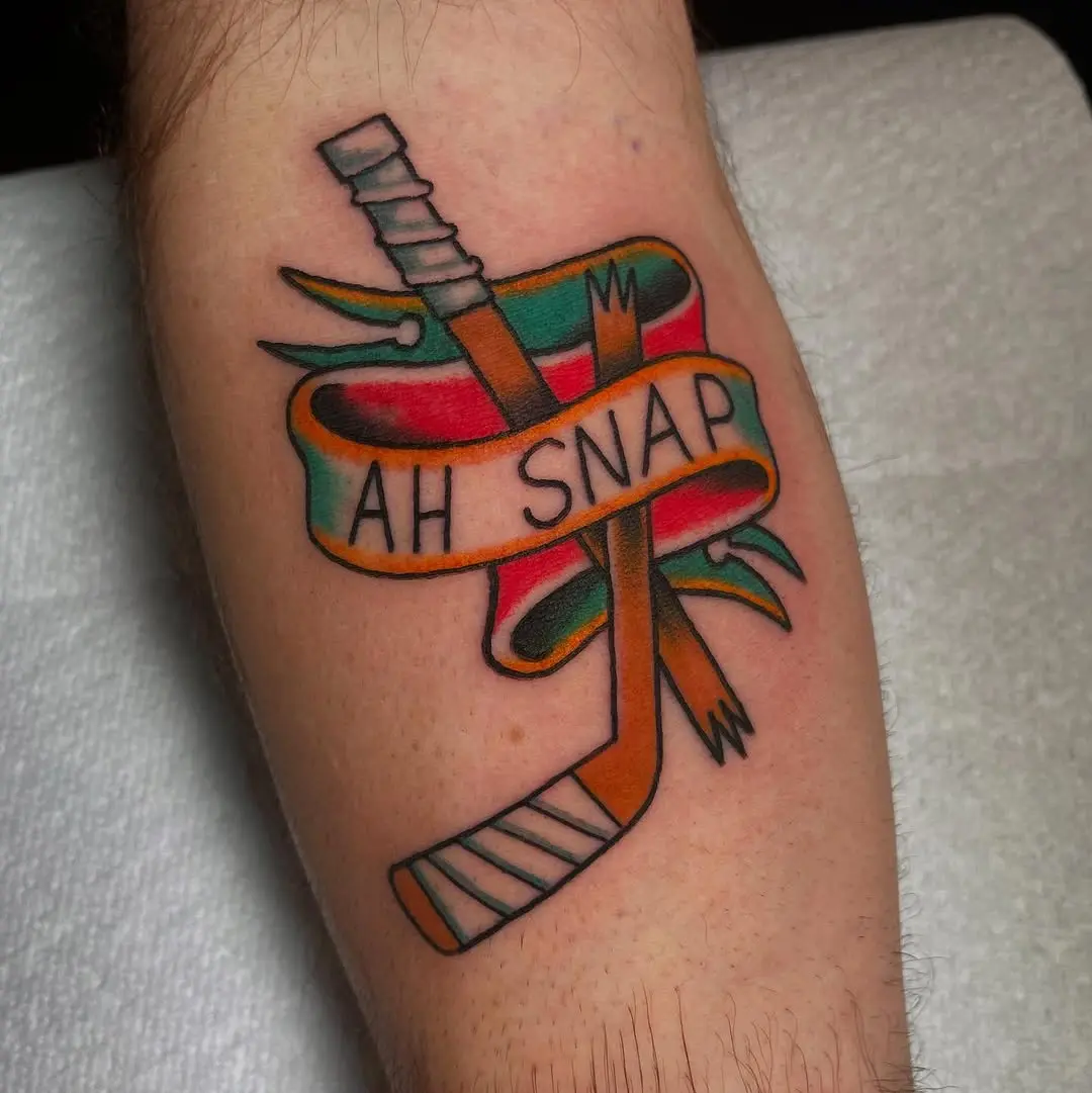 Unique hockey tattoo with playful vibes
