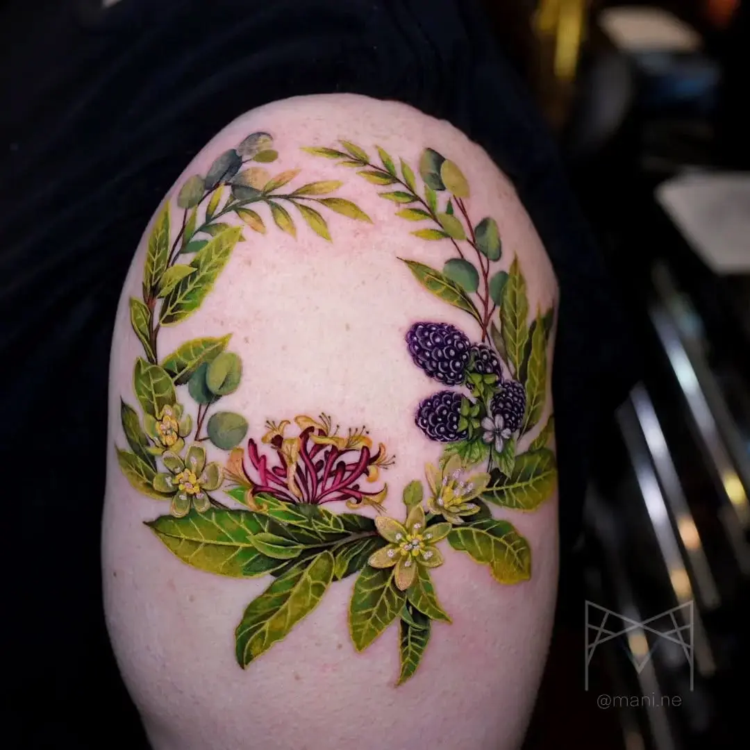 Elegant honeysuckle floral tattoo on the arm