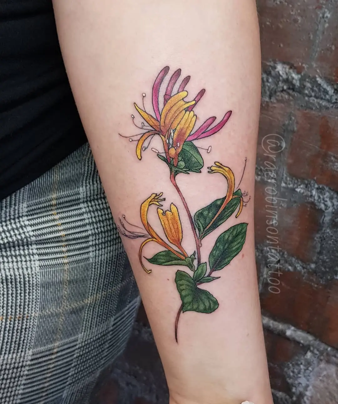 Stunning honeysuckle tattoo with vibrant colors