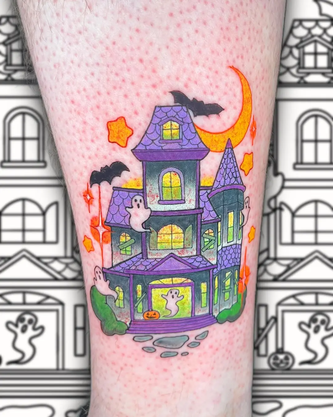 Charming haunted house tattoo with whimsical ghosts