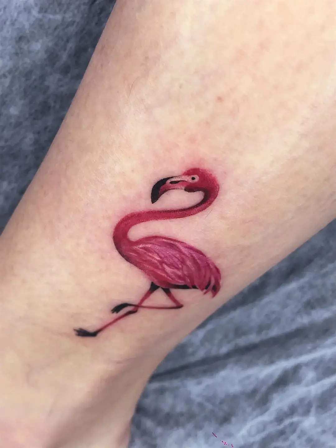 Stylish flamingo tattoo with vibrant colors