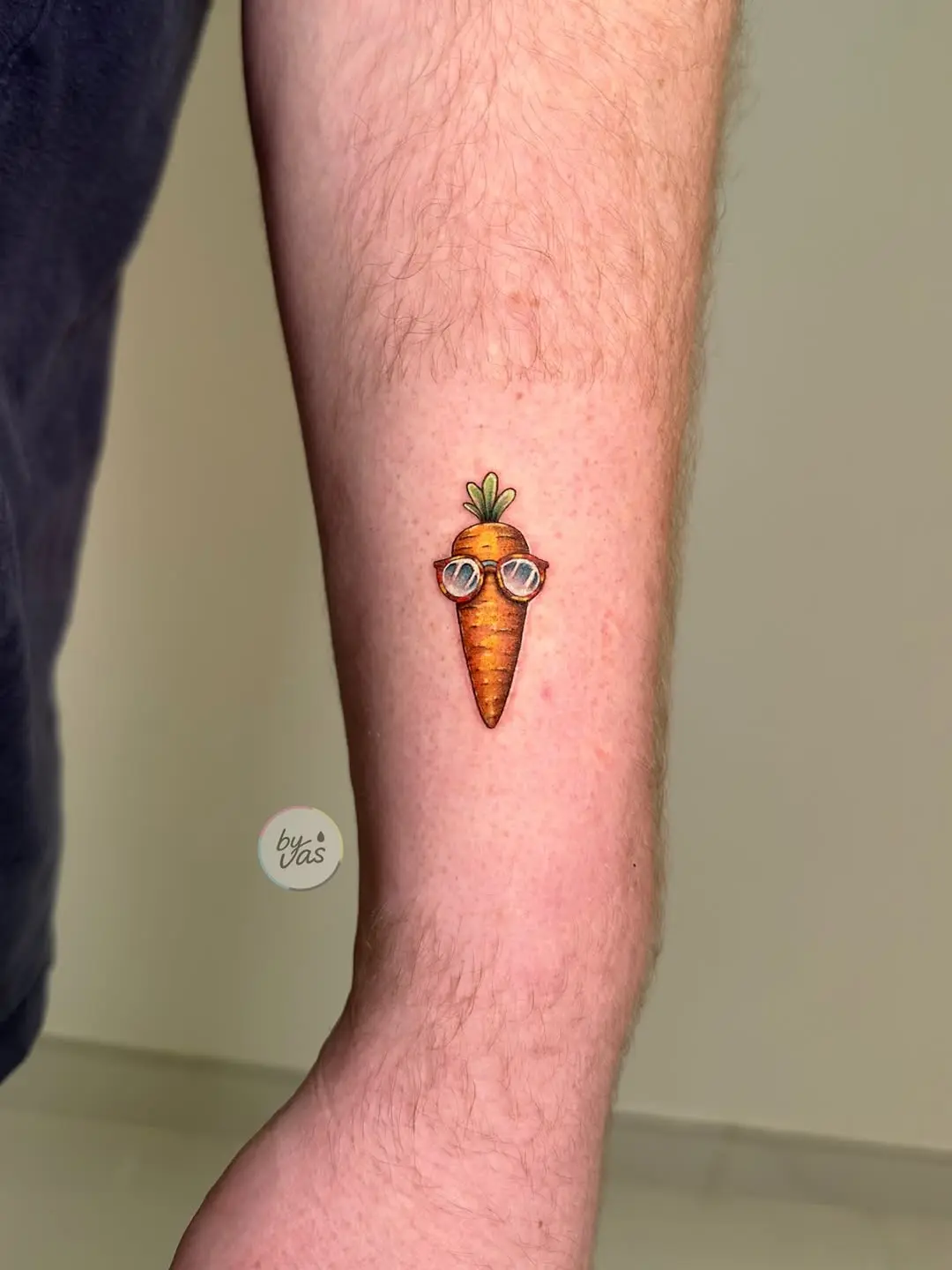 Unique carrot tattoo wearing stylish glasses