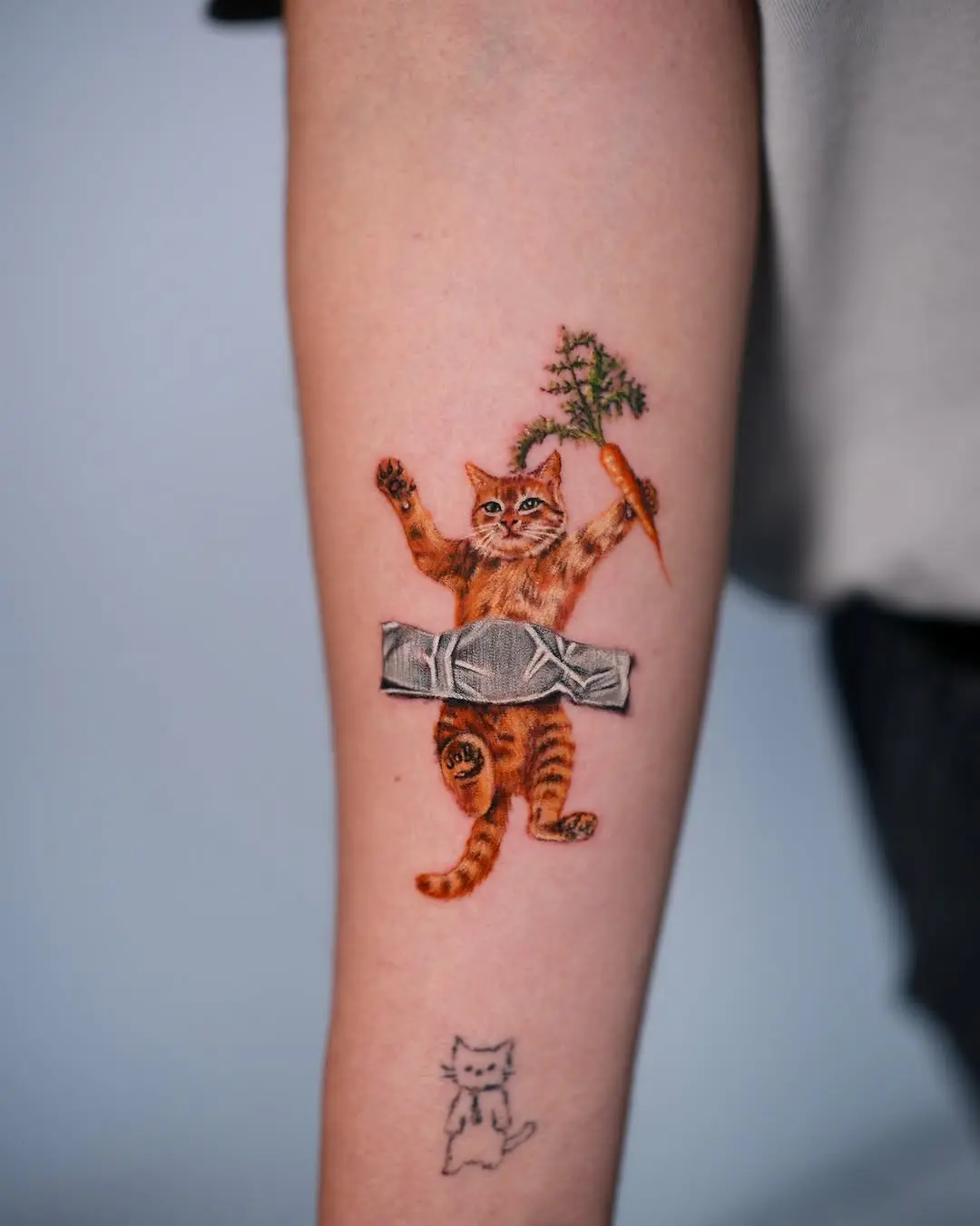 Charming cat tattoo with a carrot twist