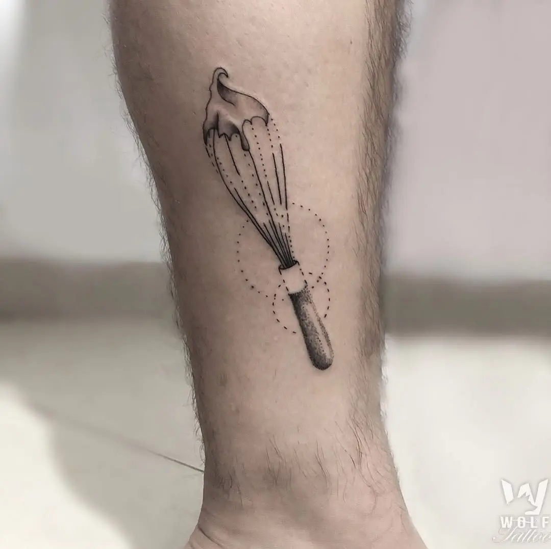 Whisk tattoo symbolizing culinary creativity