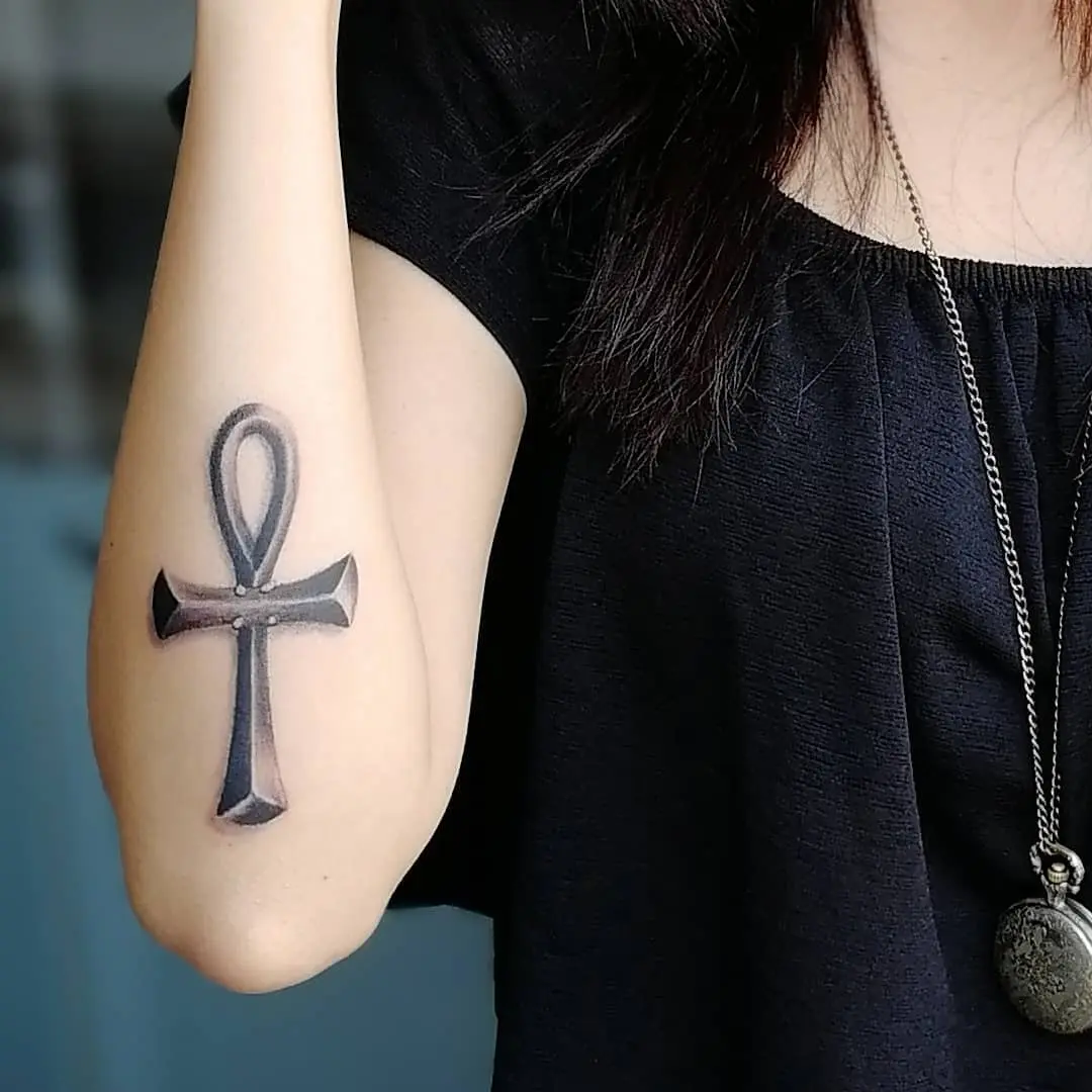 Elegant ankh tattoo on a woman's arm