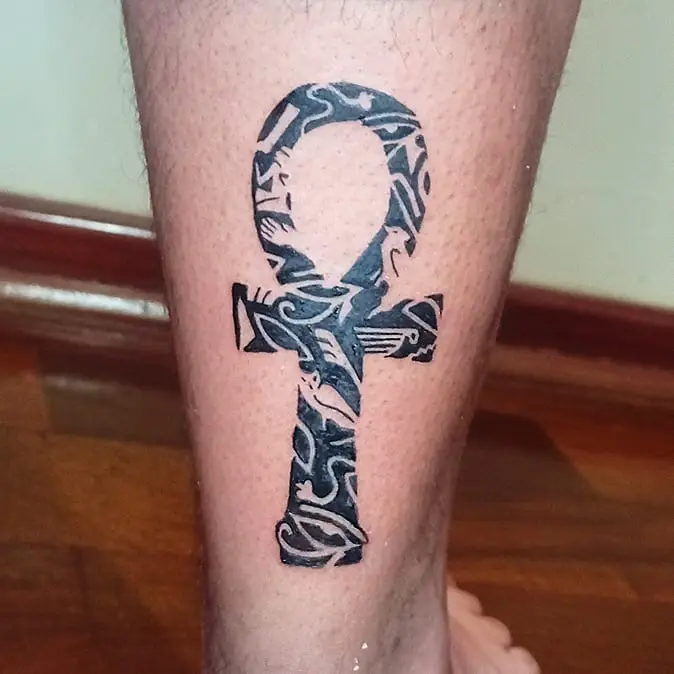Unique Ankh Tattoo Showcasing Tribal Designs