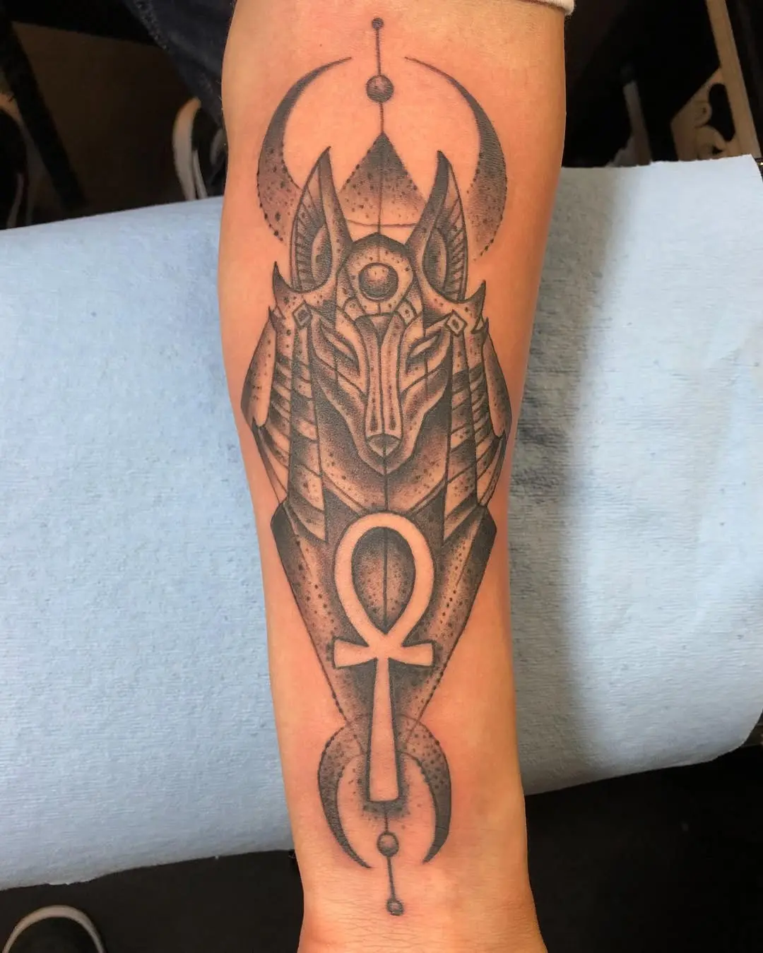 Intricate Ankh Tattoo Featuring Anubis Design