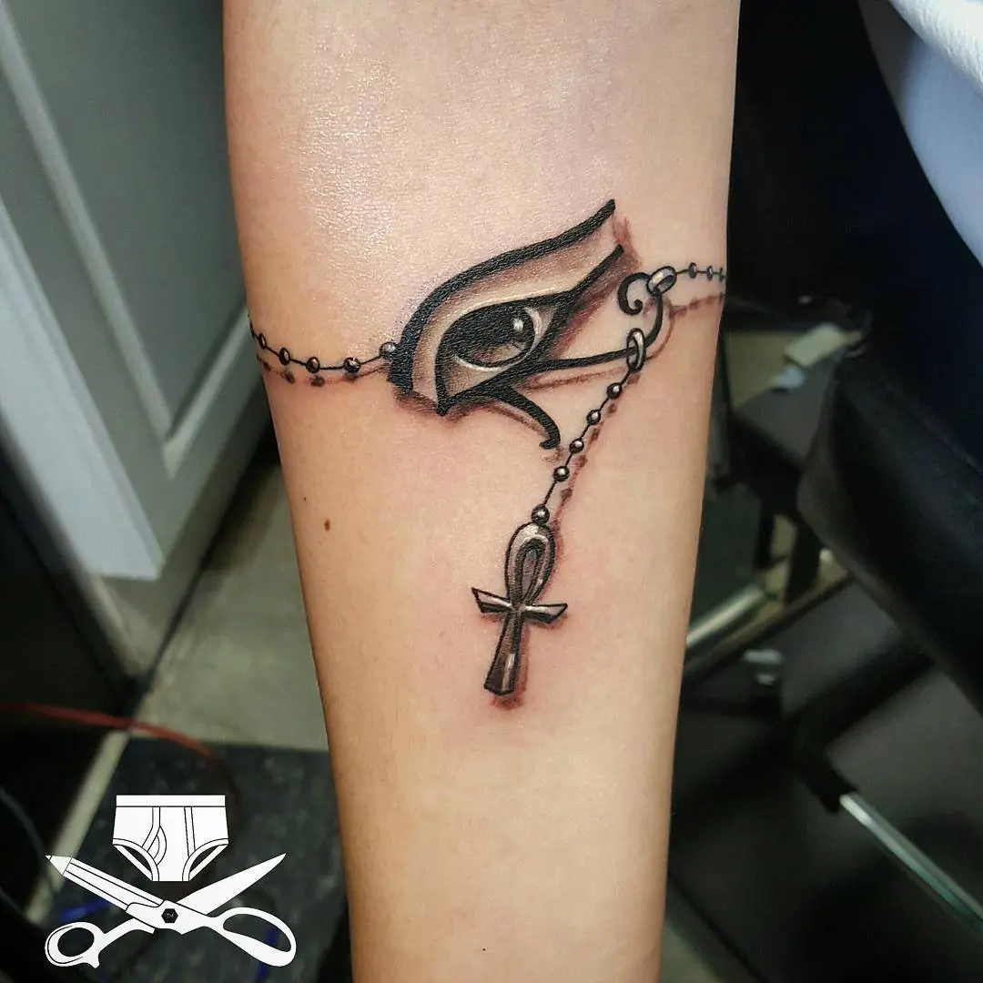 Intricate Ankh Tattoo with Eye and Chain Design
