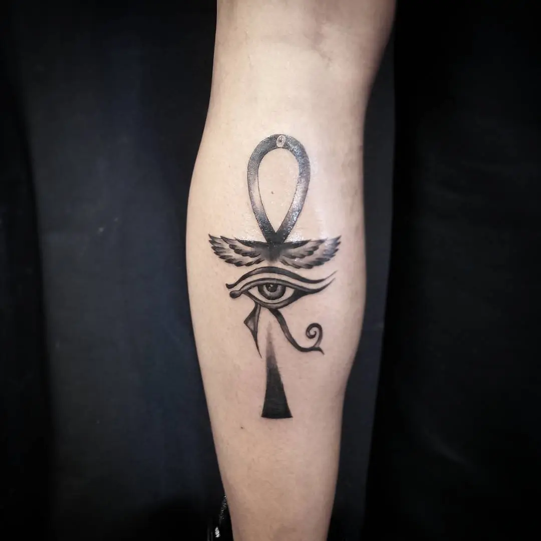 Symbolic ankh tattoo blending ancient Egyptian motifs