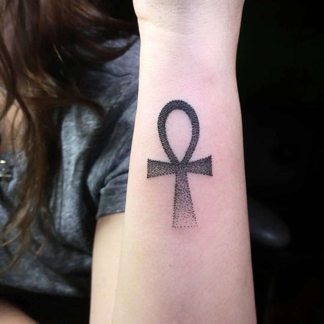 Elegant ankh tattoo showcasing minimalistic design