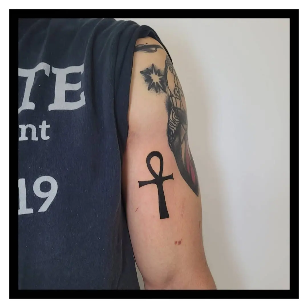 Stylish ankh tattoo in bold black ink