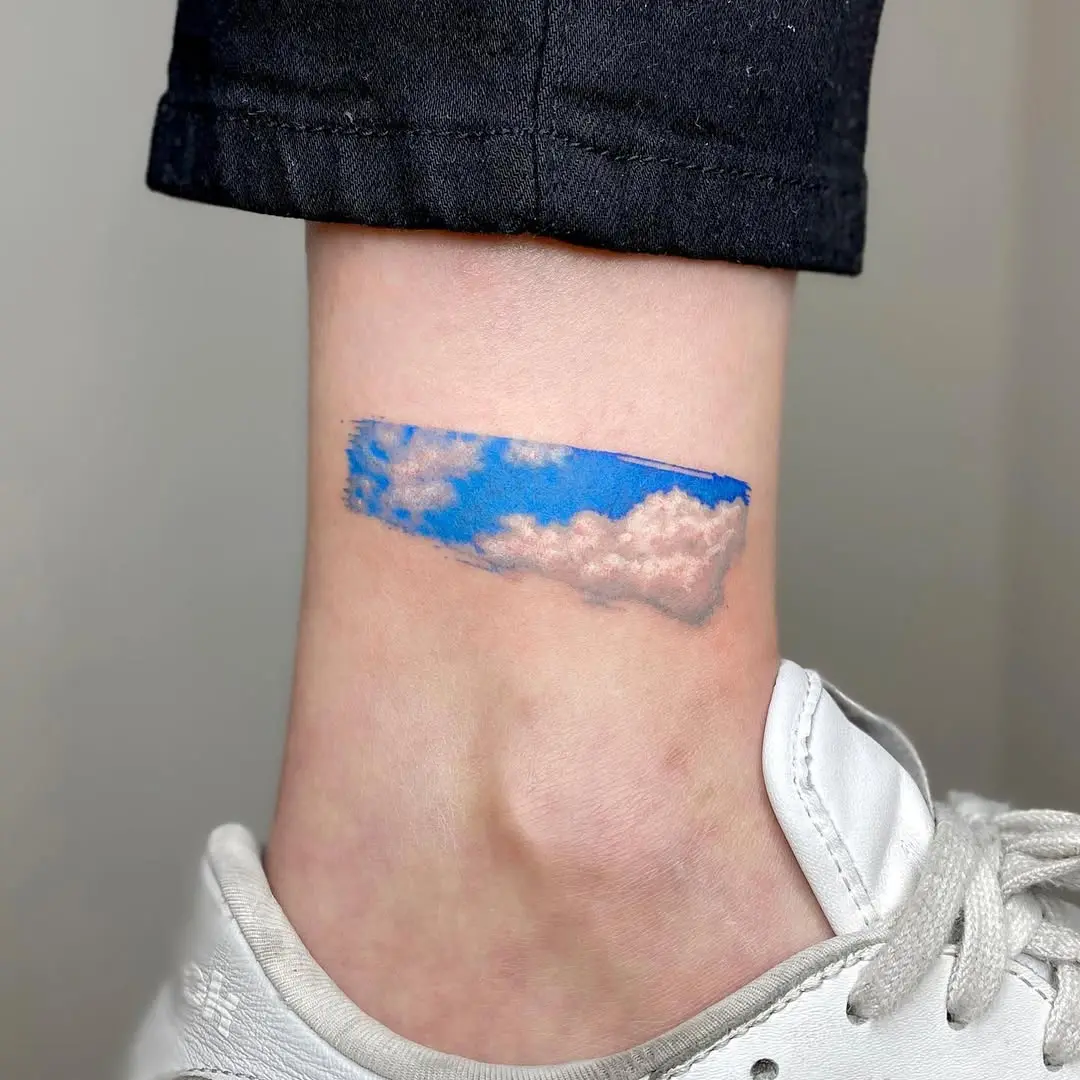 Realistic cloud tattoo on ankle