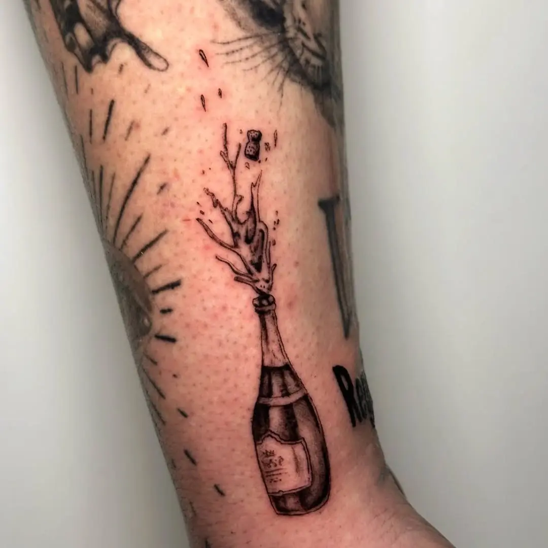 Expressive champagne tattoo with playful vibes