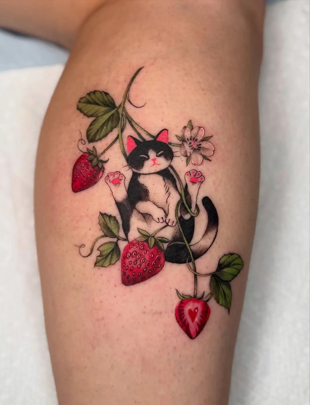 Charming cat and strawberries tattoo design