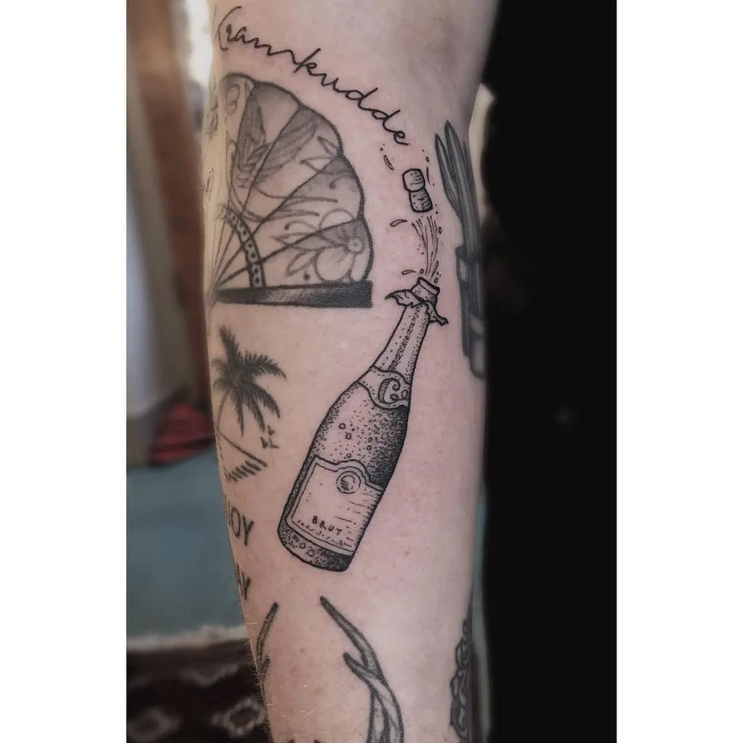 A stylish champagne bottle tattoo for celebration