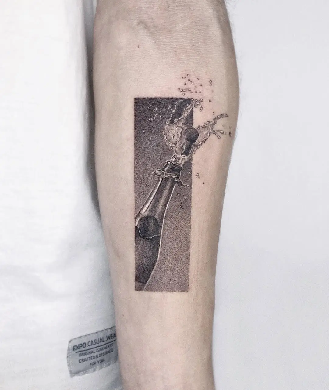 Artistic Take on Champagne Celebration Tattoos