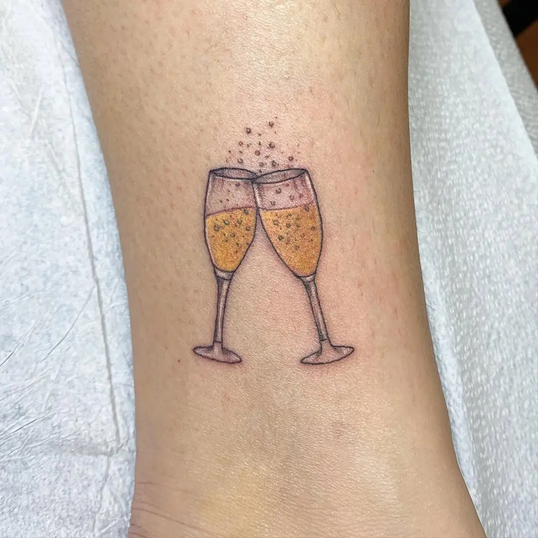 Charming champagne tattoo celebrating friendships