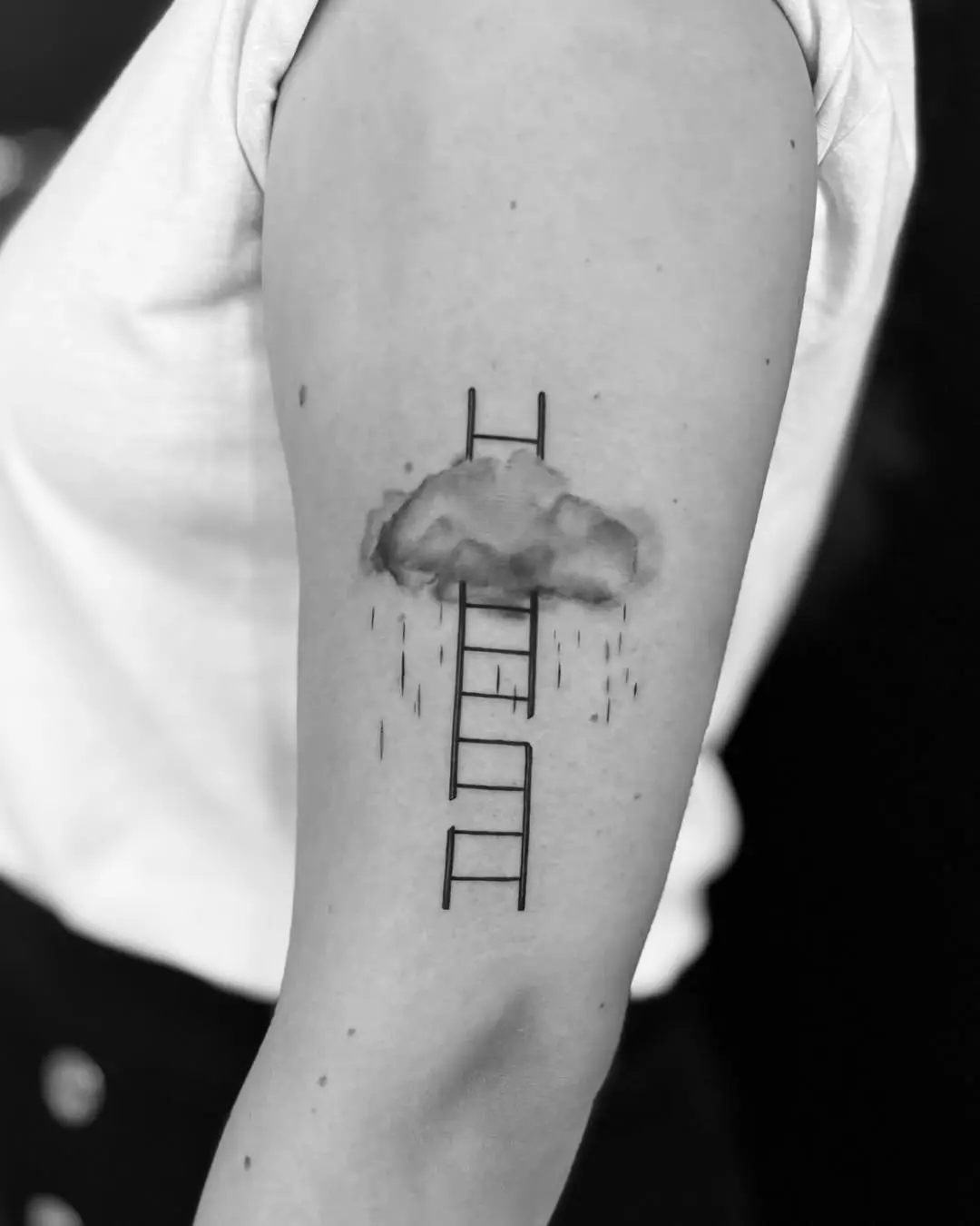 Unique cloud tattoo with a ladder motif