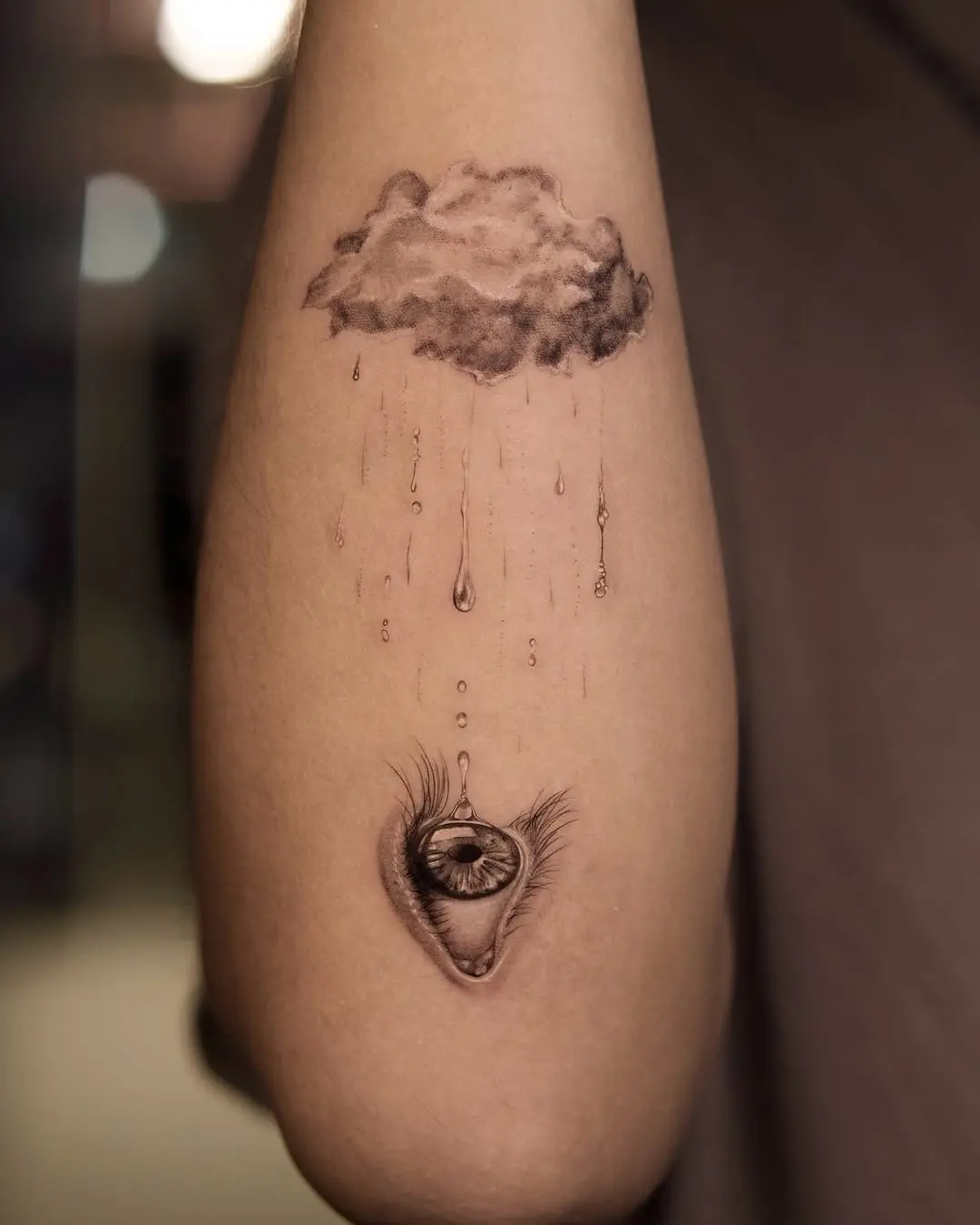 Unique cloud and eye tattoo combination