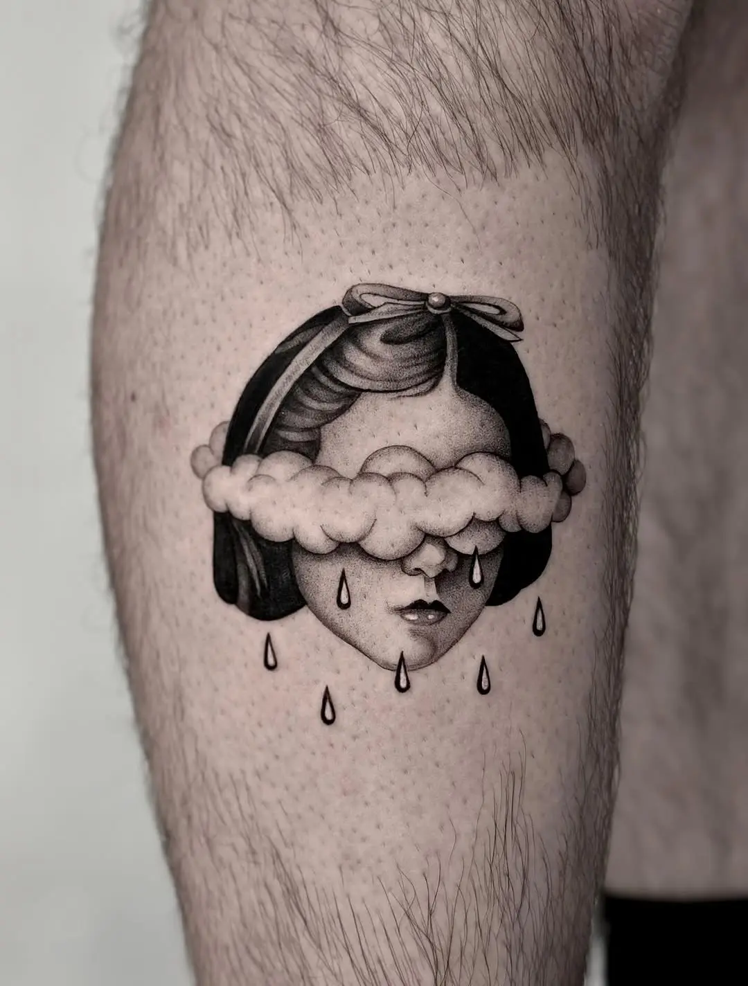 Melancholic beauty captured in cloud tattoos