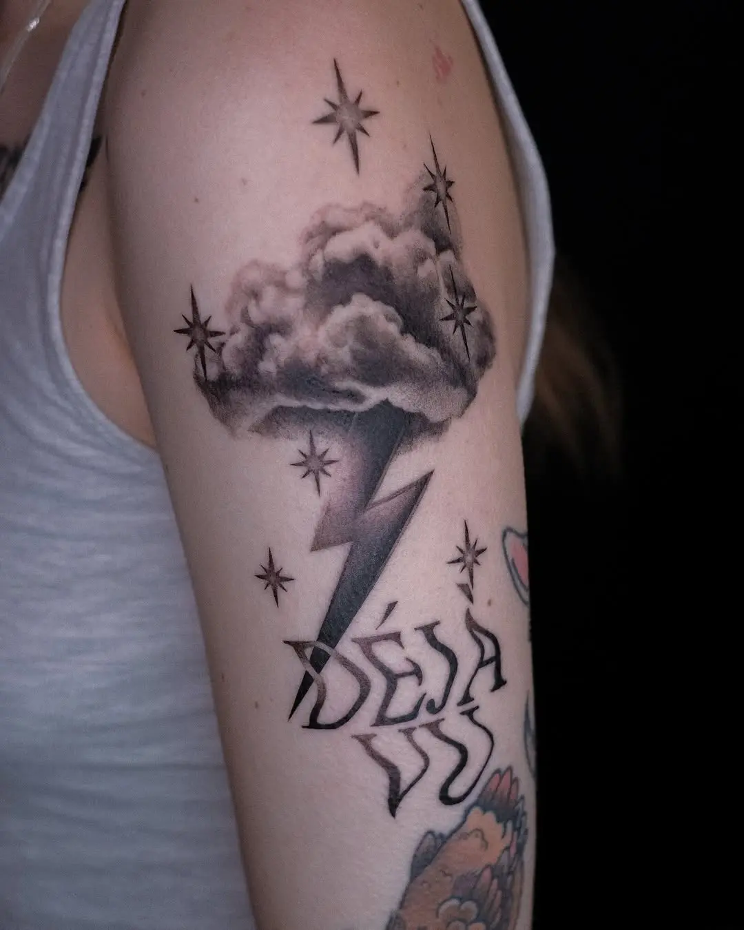 Striking cloud tattoo with lightning and stars