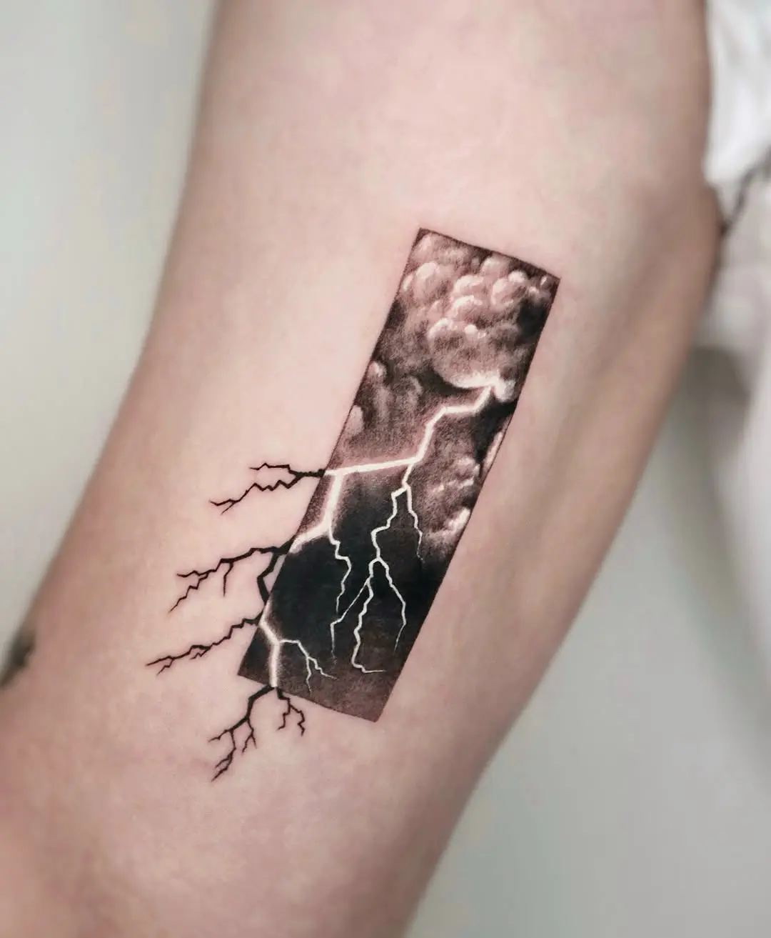 Stunning realistic cloud and lightning tattoo design