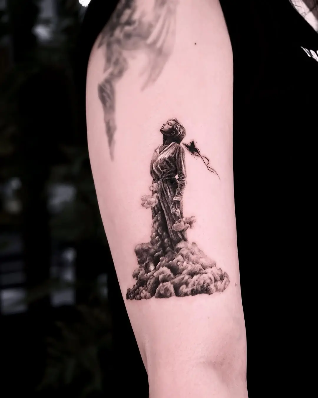 Majestic figure emerging from cloud tattoos