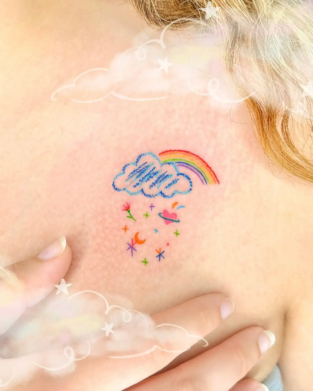 Colorful cloud tattoo with a radiant rainbow