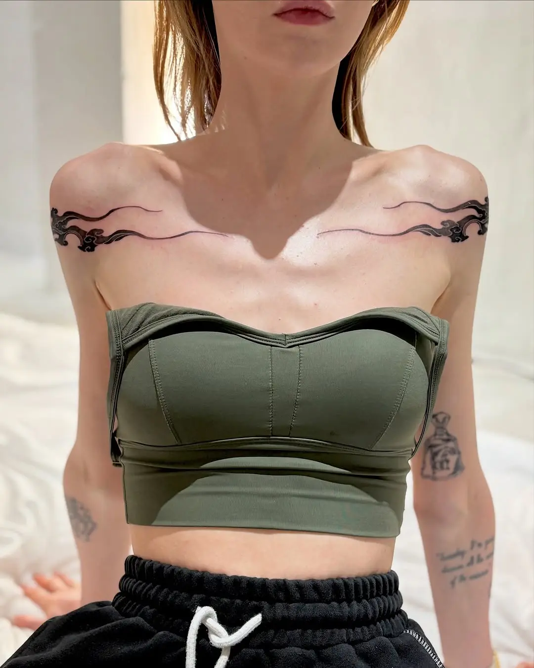 Elegant cloud tattoos gracefully adorn shoulders
