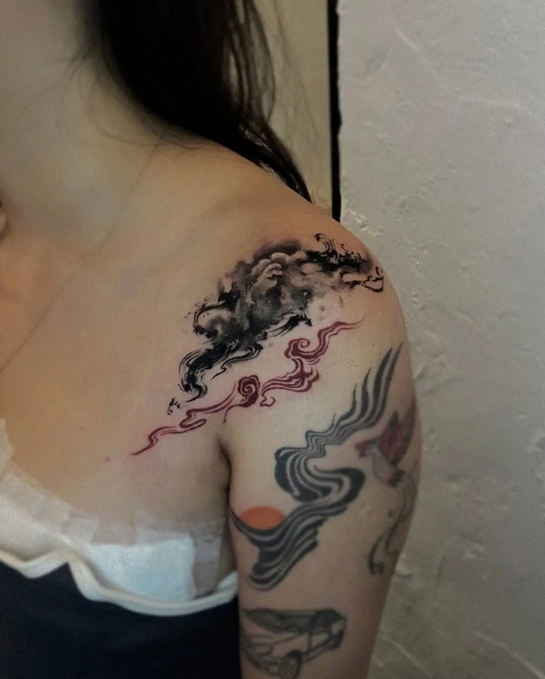 Beautiful shoulder cloud tattoo showcasing artistic flair