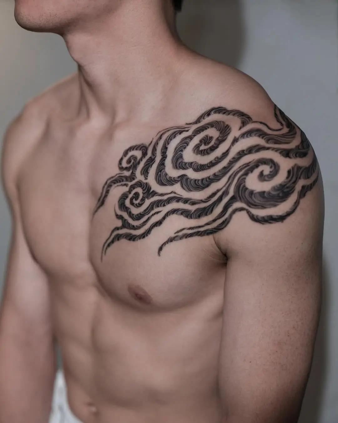 Dynamic cloud tattoo showcasing flowing elegance